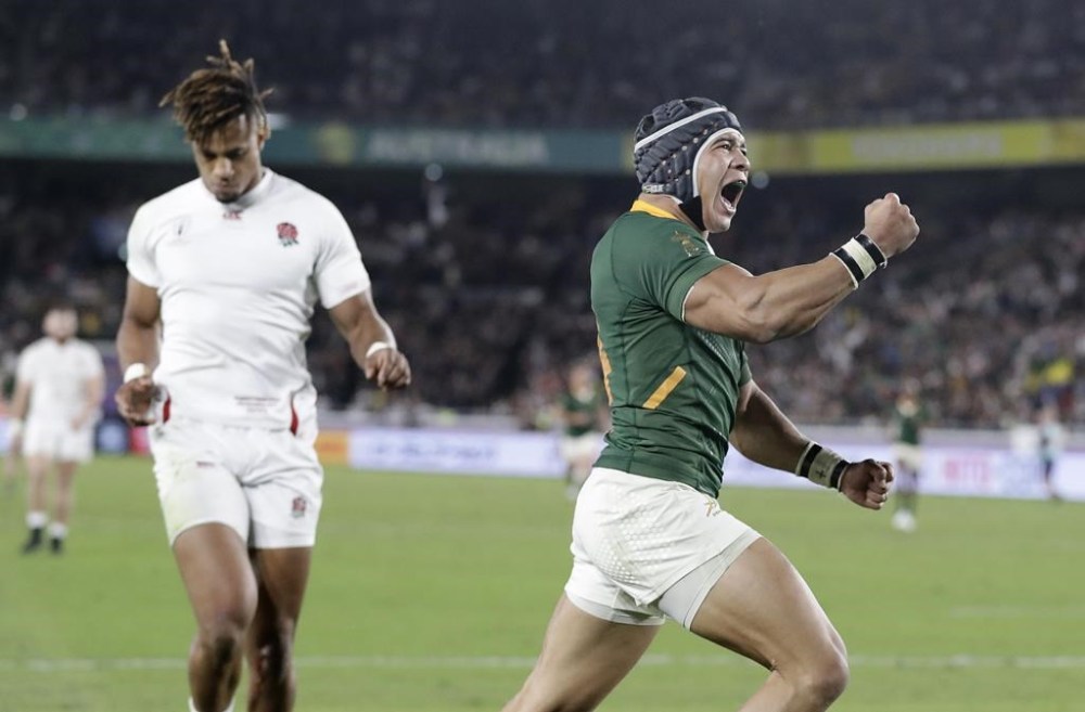 FILE - South Africa's Cheslin Kolbe celebrates scoring his side's second try during the Rugby World Cup final at International Yokohama Stadium between England and South Africa in Yokohama, Japan, on Nov. 2, 2019. South Africa and England will meet again on Saturday Oct. 21, 2023 in the semifinals at Stade de France. (AP Photo/Mark Baker, File)