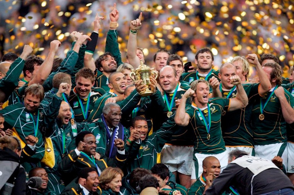 FILE - South Africa's players celebrate with the winner's trophy after the Rugby World Cup final between England and South Africa at the Stade de France in Saint-Denis, north of Paris on Oct. 20, 2007. South Africa and England will meet again on Saturday Oct. 21, 2023 in the semifinals at Stade de France. (AP Photo/Francois Mori, File)