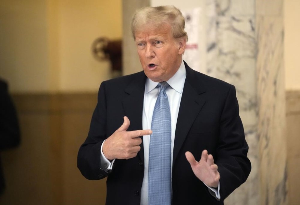 Former President Donald Trump returns to the courtroom after a break of his civil business fraud trial at New York Supreme Court, Wednesday, Oct. 18, 2023, in New York. (AP Photo/Seth Wenig)