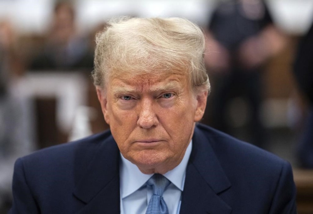 Former President Donald Trump sits in the courtroom with his legal team before the continuation of his civil business fraud trial at New York Supreme Court, Wednesday, Oct. 18, 2023, in New York. (Jeenah Moon/Pool Photo via AP)