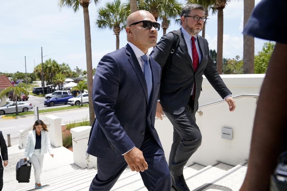 FILE - Walt Nauta, a valet to former President Donald Trump, left, arrives with defense attorney Stanley Woodward, right, at the Alto Lee Adams Sr. U.S. Courthouse for a pretrial conference to discuss procedures for handling classified information, Tuesday, July 18, 2023, in Fort Pierce, Fla. The federal judge overseeing the Florida classified documents case against Donald Trump is holding a hearing about a potential conflict of interest involving Woodward. (AP Photo/Lynne Sladky, File)