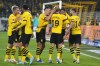 Dortmund's Julian Brandt, center, is congratulated after scoring the opening goal during the German Bundesliga soccer match between Borussia Dortmund and Werder Bremen in Dortmund, Germany, Friday, Oct. 20, 2023. (AP Photo/Martin Meissner)