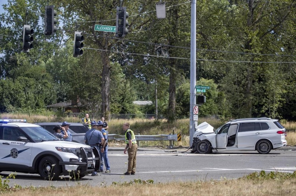 First responders investigate a crash that left six dead and others injured Sunday, July 16, 2023, in Tacoma, Wash. No one will face criminal charges following a two-car crash in Tacoma, Washington, that killed six Arizona residents in July, according to Pierce County prosecutors, Friday, Oct. 20, 2023. (Luke Johnson/The Seattle Times via AP)