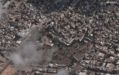This image provided by Maxar Technologies on Wednesday, Oct. 18, 2023, shows an overview of the al-Ahli Hospital, center of image, in Gaza City after a deadly explosion. (Satellite image ©2023 Maxar Technologies via AP)