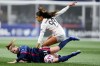 Angel City FC defender Madison Hammond (99) falls against OL Reign forward Veronica Latsko (24) during the first half of an NWSL quarterfinal playoff soccer match Friday, Oct. 20, 2023, in Seattle. (AP Photo/Lindsey Wasson)