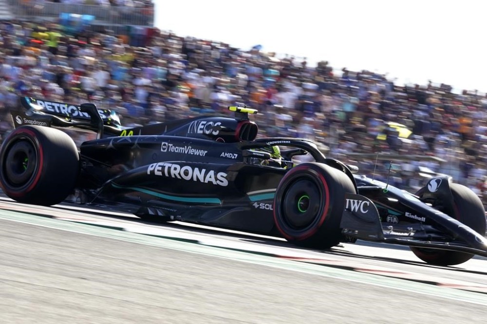 Mercedes driver Lewis Hamilton, of Britain, steers through a turn during a qualifying session for the Formula One U.S. Grand Prix auto race at Circuit of the Americas, Friday, Oct. 20, 2023, in Austin, Texas. (AP Photo/Eric Gay)