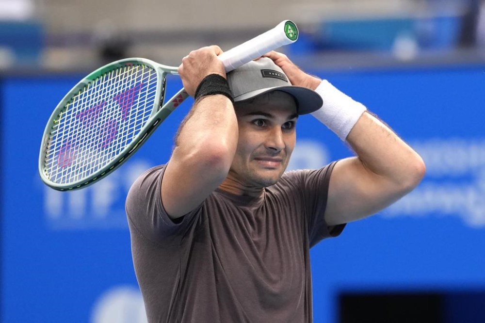 Marcos Giron of the U.S. reacts to a point lost to his compatriot Ben Shelton during the semifinal of Japan Open Tennis Championship in Tokyo, Japan, Saturday, Oct. 21, 2023. (AP Photo/Shuji Kajiyama)