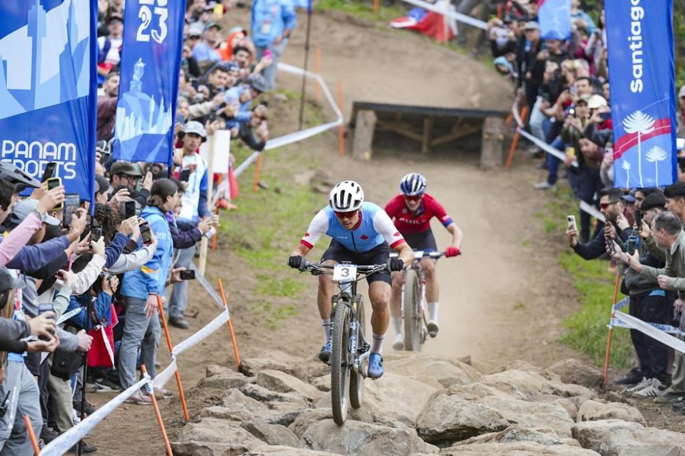 Gunnar Holmgren of Canada competes in the Men’s Mountain Bike Cross Country event on his way to winning a gold medal during the Santiago 2023 Pan American Games on Saturday, October 21, 2023. THE CANADIAN PRESS/HO-COC-Thomas Skrlj **MANDATORY CREDIT**