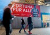 People arrive for the match between Fortuna Dusseldorf and FC Kaiserslautern, in Duesseldorf, Germany, Saturday, Oct, 21, 2023. The crowd watching Fortuna Duesseldorf in German soccer's second division all got in for free. Saturday's game was the first step in an audacious plan which Fortuna hopes could revolutionize soccer. (Roland Weihrauch/dpa via AP)