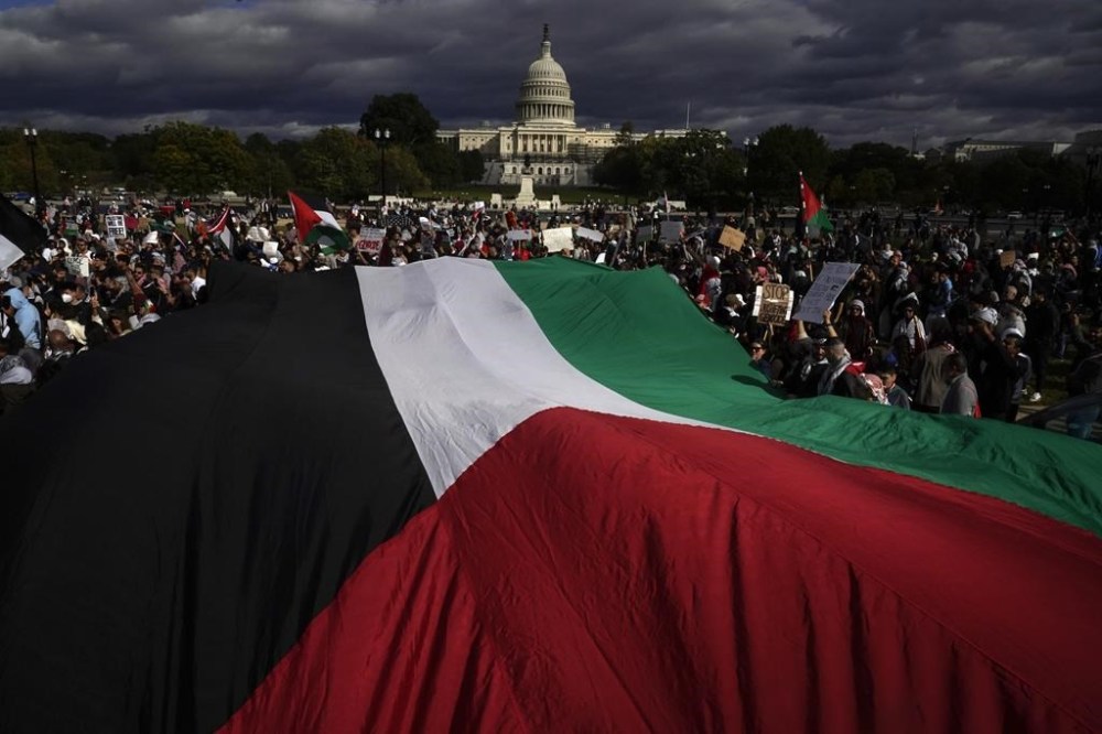 People march towards the U.S. Capitol during a pro-Palestinian march calling for a ceasefire in Gaza, Saturday, Oct. 21, 2023, in Washington. (AP Photo/Andrew Harnik)