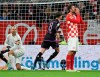 Munich's Leon Goretzka, centre, runs after scoring a goal, during the Bundesliga soccer match between Mainz 05 and Bayern Munich at Mewa Arena in Mainz, Germany, Saturday, Oct. 21, 2023. (Arne Dedert/dpa via AP)
