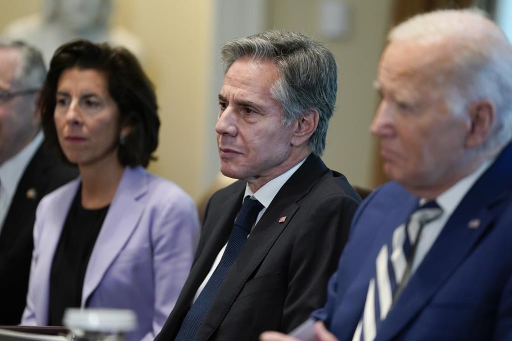 From left, Commerce Secretary Gina Raimondo, Secretary of State Antony Blinken and President Joe Biden listen during a meeting with European Council President Charles Michel and European Commission President Ursula von der Leyen in the Cabinet Room of the White House, Friday, Oct. 20, 2023, in Washington. (AP Photo/Evan Vucci)