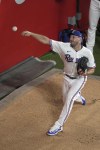 Texas Rangers starting pitcher Max Scherzer warms up before Game 3 of the baseball American League Championship Series against the Houston Astros Wednesday, Oct. 18, 2023, in Arlington, Texas. (AP Photo/Tony Gutierrez)