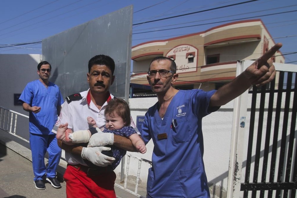 Palestinians wounded in the Israeli bombardment of the Gaza Strip are brought to a hospital in Rafah on Monday, Oct. 23, 2023. (AP Photo/Hatem Ali)