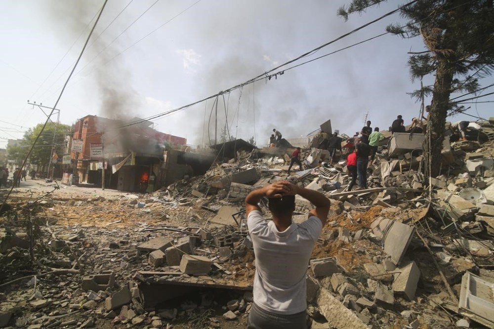 A Canadian man trapped in Gaza with his family says Israeli bombs that used to drop every hour when the war between Israel and Hamas started are now dropping relentlessly every few minutes. Palestinians look for survivors of the Israeli bombardment of the Gaza Strip in Rafah on Monday, Oct. 23, 2023. THE CANADIAN PRESS/AP-Hatem Ali