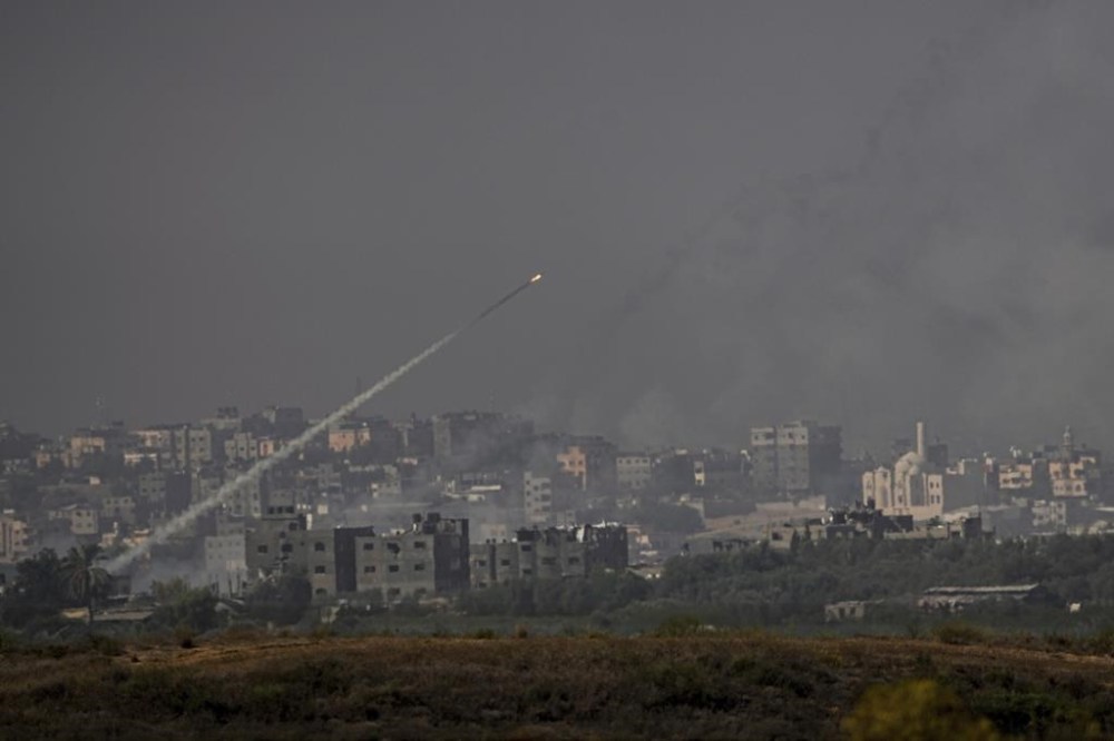 Rockets are fired toward Israel from the Gaza Strip, as seen from southern Israel, Monday, Oct. 23, 2023. (AP Photo/Ariel Schalit)