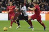Udinese's Isaac Success and Lecce's Pontus Almqvist, right, vie for the ball during the Italian Serie A soccer match between Udinese and Lecce at the Friuli Stadium in Udine, Italy, Monday, Oct. 23, 2023. (Andrea Bressanutti/LaPresse via AP)
