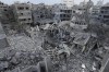 FILE - Palestinians inspect the rubble of the Yassin Mosque destroyed after it was hit by an Israeli airstrike at Shati refugee camp in Gaza City, early Monday, Oct. 9, 2023. (AP Photo/Adel Hana, File)
