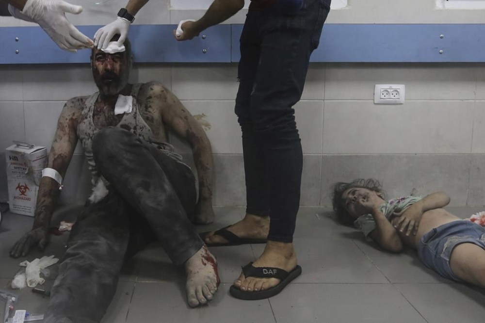 Wounded Palestinians receive treatment at the al-Shifa hospital, following Israeli airstrikes on Gaza City, central Gaza Strip, Monday, Oct. 23, 2023. (AP Photo/Abed Khaled)