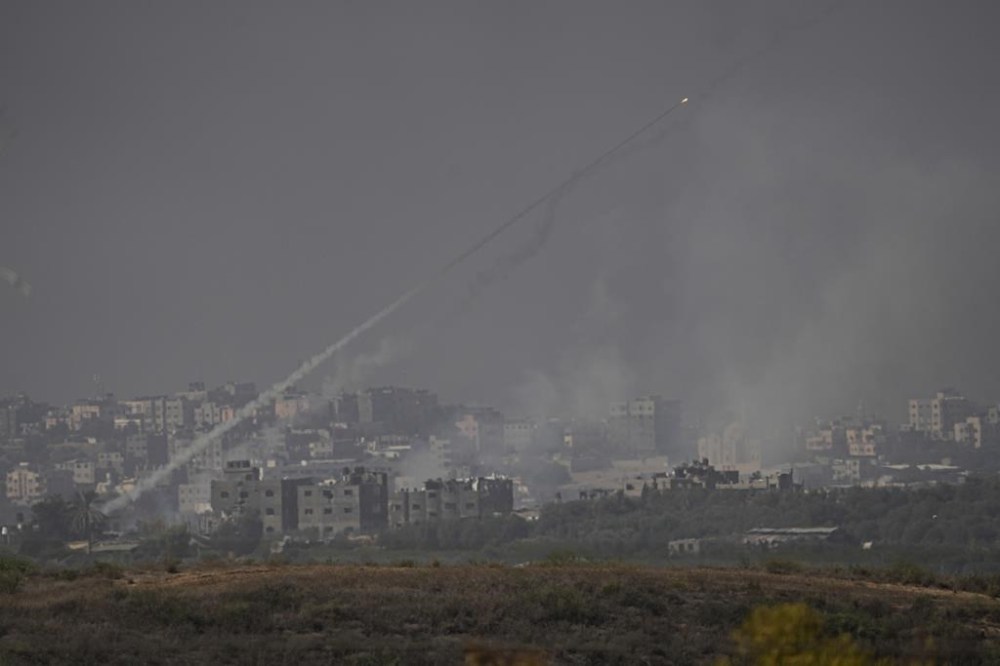 Rockets are fired toward Israel from the Gaza Strip, as seen from southern Israel, Monday, Oct. 23, 2023. (AP Photo/Ariel Schalit)