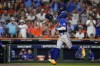 Texas Rangers' Adolis Garcia reacts after hitting a home run during the third inning of Game 6 of the baseball AL Championship Series against the Houston Astros Monday, Oct. 23, 2023, in Houston. (AP Photo/David J. Phillip)