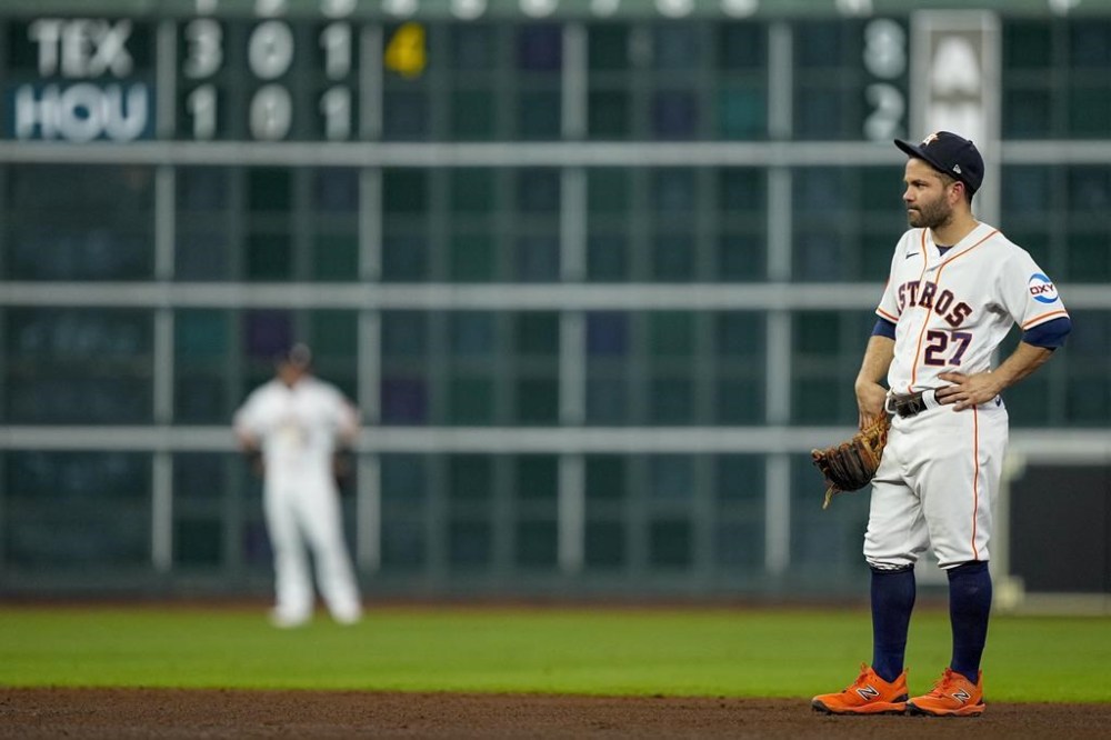 Houston Astros' Jose Altuve reacts during the fourth inning of Game 6 of the baseball AL Championship Series against the Texas Rangers Monday, Oct. 23, 2023, in Houston. (AP Photo/David J. Phillip)