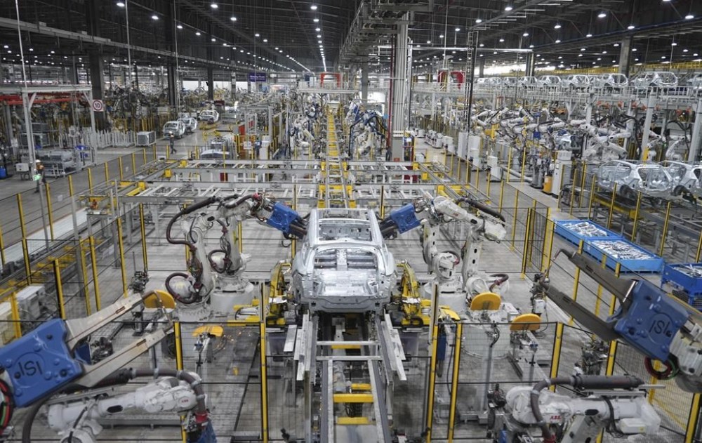 A car frame is being welded by robots at a Vinfast factory in Hai Phong, Vietnam on Sept. 29, 2023. Vietnamese automaker Vinfast has plunged right into the crowded and hypercompetitive U.S. auto market, gambling that if it can sell its electric vehicles to finicky Americans, it can succeed anywhere. So far, that gamble has yet to pay off. (AP Photo/Hau Dinh)