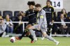 Columbus Crew forward Jacen Russell-Rowe, left, passes the ball in front of CF Montreal defender Joel Waterman during the second half of an MLS soccer match in Columbus, Ohio, Saturday, Oct. 21, 2023. The Crew won 2-1. THE CANADIAN PRESS/AP-Paul Vernon