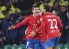 Atletico Madrid's Alvaro Morata, left, celebrates scoring his side's second goal of the game with teammates, during the Champions League Group E match between Celtic Glasgow and Atletico Madrid, at Celtic Park, in Glasgow, Scotland, Wednesday, Oct. 25, 2023. (Andrew Milligan/PA via AP)
