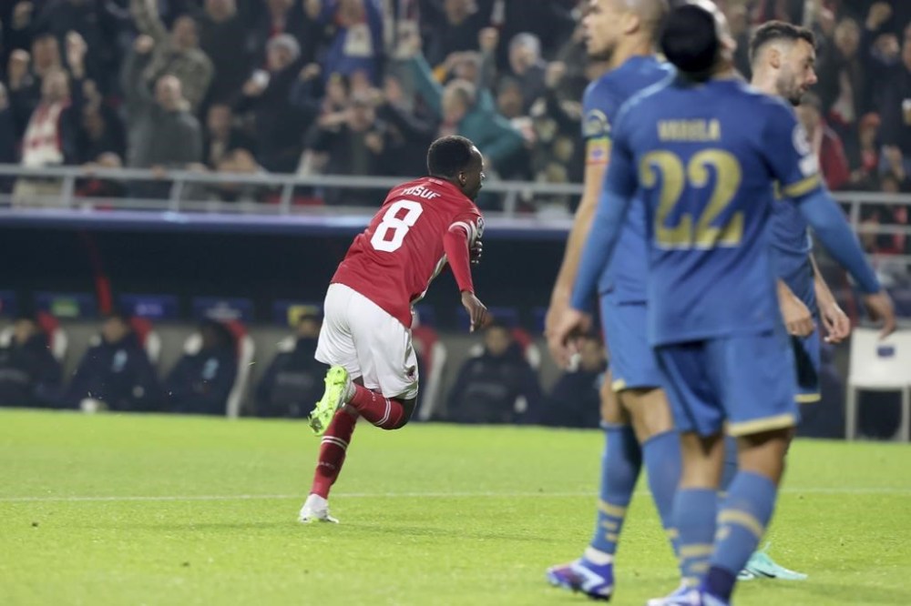 Royal Antwerp's Alhassan Yusuf celebrates after scoring the opening goal during the Champions League Group H soccer match between Royal Antwerp and FC Porto at the Bosuil Stadium, Antwerp, Belgium, Wednesday, Oct. 25, 2023. (AP Photo/Francois Walschaerts)