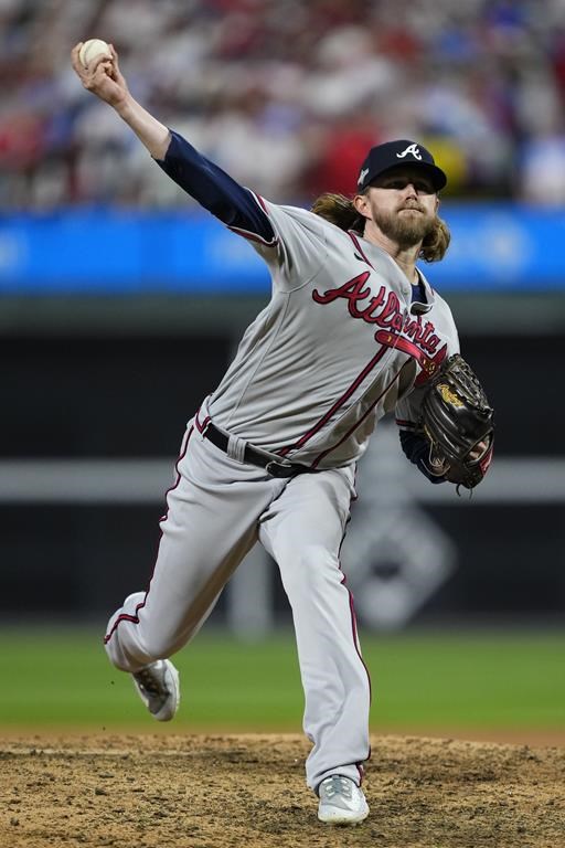 Atlanta Braves relief pitcher Pierce Johnson throws during the seventh inning of Game 4 of a baseball NL Division Series against the Philadelphia Phillies Thursday, Oct. 12, 2023, in Philadelphia. (AP Photo/Matt Rourke)
