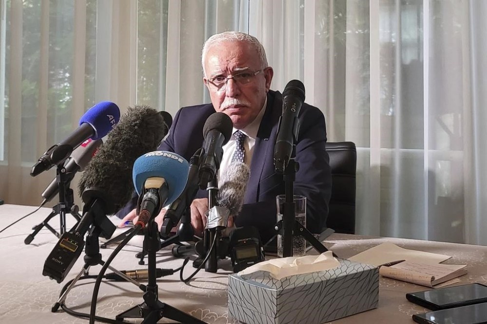 The Palestinian Authority’s foreign minister Riyad al-Maliki speaks to reporters in The Hague, Netherlands, Thursday Oct. 26, 2023, during a two-day visit to The Hague to meet with ICC chief prosecutor Karim Khan. (AP Photo/Molly Quell)