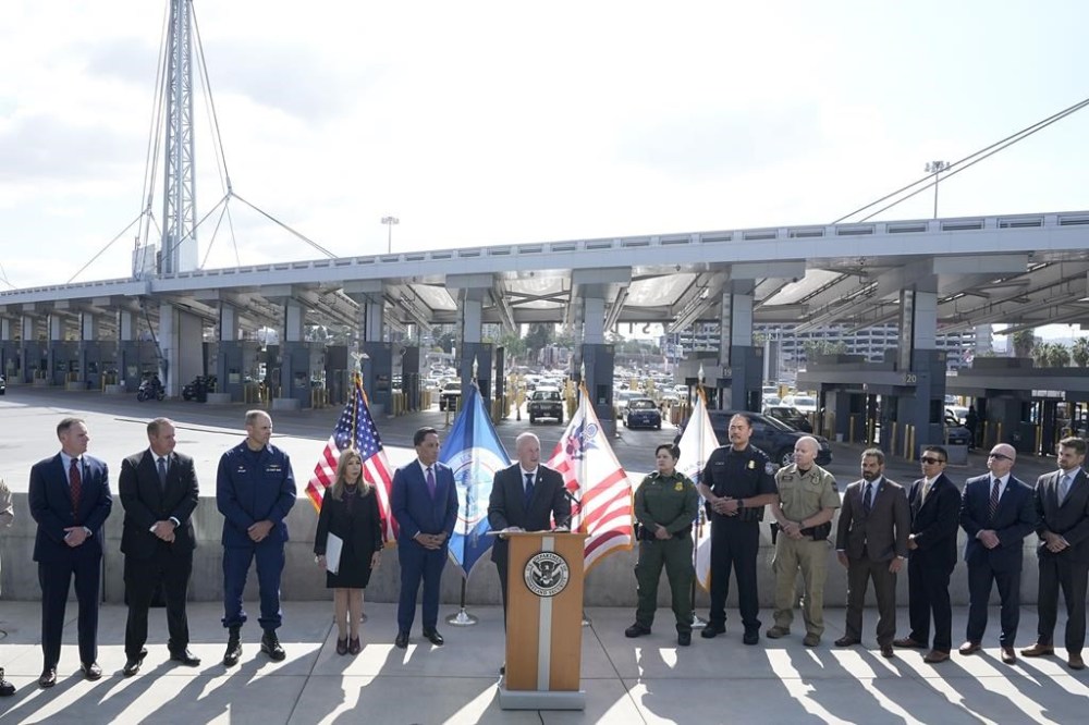 Acting commissioner of Customs and Border Protection Troy Miller, center, speaks during a news conference at the San Ysidro Port of Entry, Thursday, Oct. 26, 2023, in San Diego. The U.S. Customs and Border Protection has announced a new government-wide strategy that will target not only fentanyl but precursor materials used to make the synthetic opioid.(AP Photo/Gregory Bull)