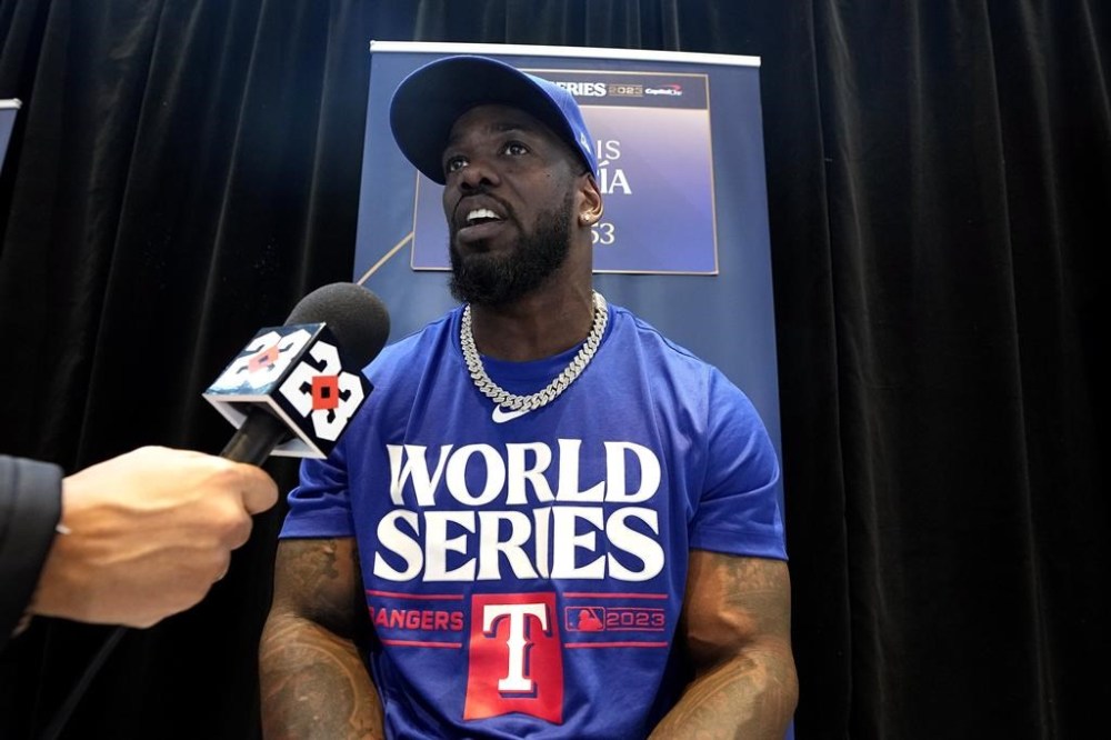 Texas Rangers right fielder Adolis Garcia answers a question during a World Series baseball media day Thursday, Oct. 26, 2023, in Arlington, Texas. The Rangers will play the Arizona Diamondbacks in Game 1 of the World Series tomorrow. (AP Photo/Tony Gutierrez)