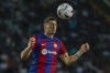 Barcelona's Robert Lewandowski heads the ball during a Spanish La Liga soccer match between Barcelona and Sevilla, at the Olympic Stadium of Montjuic in Barcelona, Spain, Friday, Sept. 29, 2023. (AP Photo/Joan Monfort)