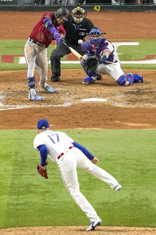 Arizona Diamondbacks' Ketel Marte hits a RBI double off Texas Rangers starting pitcher Nathan Eovaldi during the fifth inning in Game 1 of the baseball World Series Friday, Oct. 27, 2023, in Arlington, Texas. (AP Photo/Tony Gutierrez)