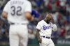 Texas Rangers' Adolis Garcia reacts after being stranded on base after the final out during the eighth inning in Game 1 of the baseball World Series against the Arizona Diamondbacks Friday, Oct. 27, 2023, in Arlington, Texas. (AP Photo/Godofredo A. Vásquez)