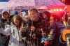 Brian Sweeney, centre, father of shooting victim Angie Sweeney, is seen during candlelight vigil with his son and the mother of the shooter, Marcia Gillespie, in Sault Ste. Marie, Ont., Friday, Oct. 27, 2023. Earlier this week, a man killed four people -- including three children -- before turning a gun on himself in the northern Ontario city in what police are calling a case of intimate partner violence. THE CANADIAN PRESS/Robert Davies