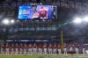 Members the the Arizona Diamondbacks line up before Game 1 of the baseball World Series against the Texas Rangers Friday, Oct. 27, 2023, in Arlington, Texas. (AP Photo/Brynn Anderson)