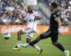 Philadelphia Union's Kai Wagner, right, battles for the ball New England Revolution's Andrew Farrell (88) during an MLS playoff soccer game, Saturday, Oct. 28, 2023, in Philadelphia. (AP Photo/Joe Lamberti)