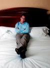 FILE - Actor Matthew Perry poses in his hotel bedroom in New York, Aug. 7, 2002. Perry, who starred Chandler Bing in the hit series “Friends,” has died. He was 54. The Emmy-nominated actor was found dead of an apparent drowning at his Los Angeles home on Saturday, according to the Los Angeles Times and celebrity website TMZ, which was the first to report the news. Both outlets cited unnamed sources confirming Perry’s death. His publicists and other representatives did not immediately return messages seeking comment. (AP photo/Gino Domenico, File)
