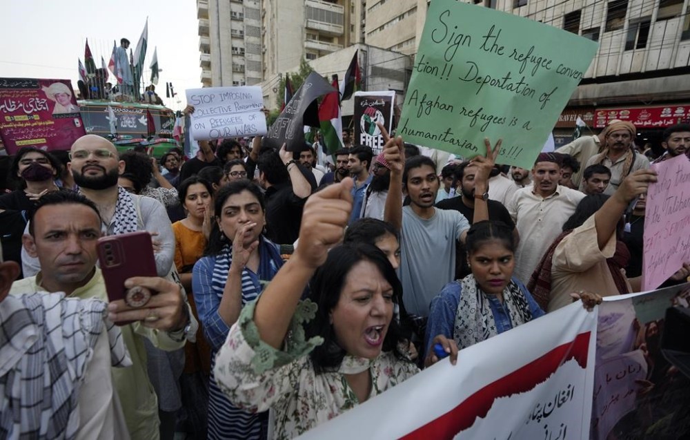 A social group, Aurat March, hold signs during a demonstration against Pakistani government, in Karachi, Pakistan, Sunday, Oct. 29, 2023. Pakistan says it has recently announced plans to deport all migrants who are in the country illegally, including 1.7 million Afghans, who will be implemented in a