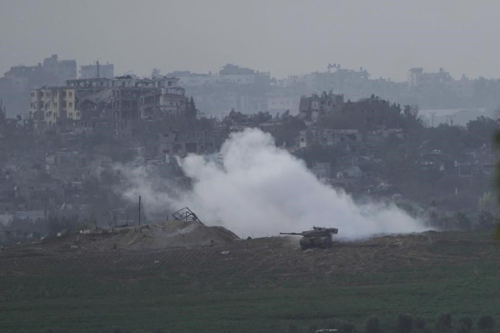 Israeli tanks take position along the Israeli border with the Gaza Strip, as seen from southern Israel, Sunday, Oct. 29, 2023. (AP Photo/Maya Alleruzzo)