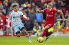 Nottingham Forest's Morgan Gibbs-White, left, Liverpool's Kostas Tsimikas in action during the English Premier League soccer match between Liverpool and Nottingham Forest, at Anfield in Liverpool, England, Sunday, Oct. 29, 2023. (AP Photo/Jon Super)
