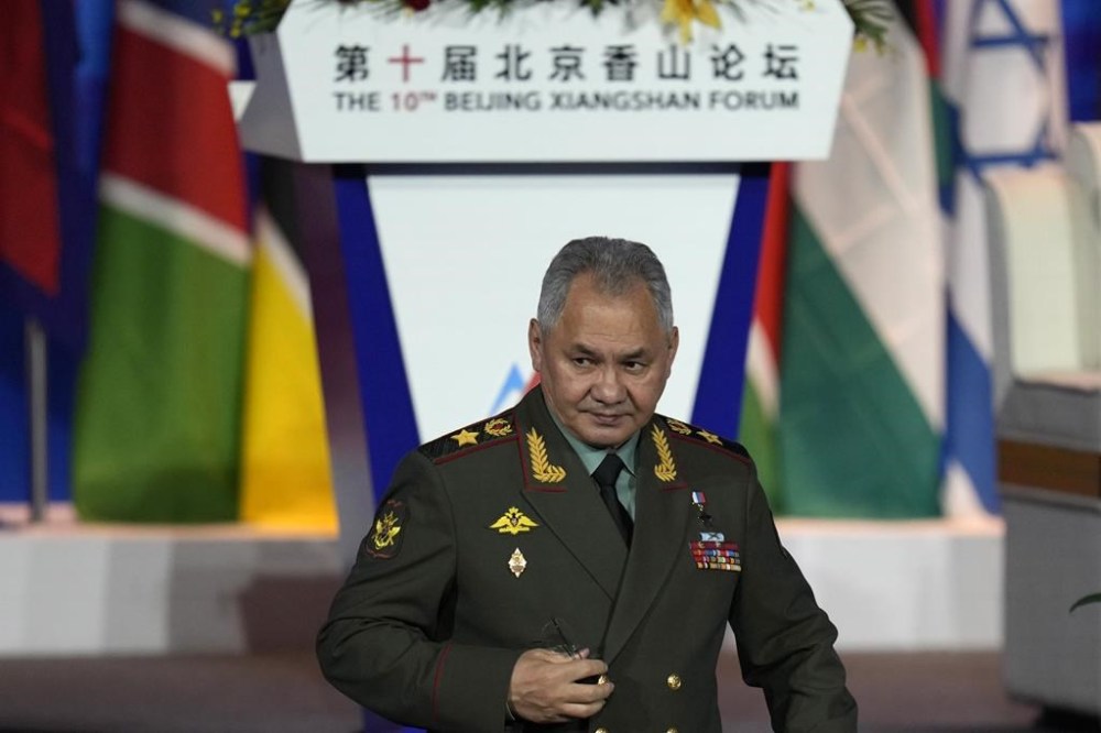 Russian Defense Minister Sergei Shoigu walks down from the podium after speaking at the 10th Beijing Xiangshan Forum in Beijing, Monday, Oct. 30, 2023. Defense Minister Shoigu said Monday the United States is fueling geopolitical tensions to uphold its