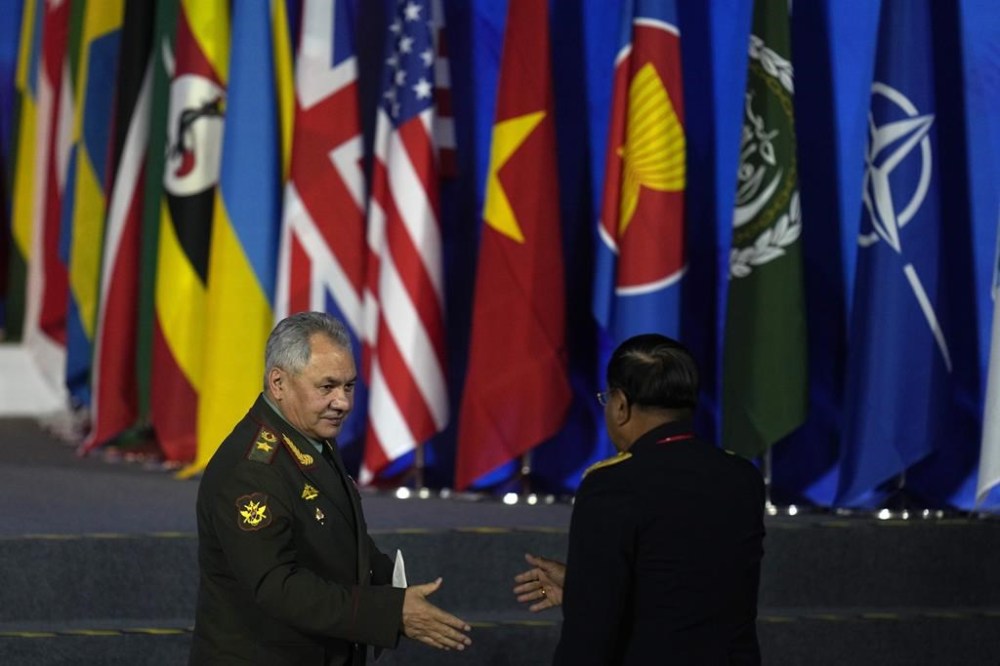 Russian Defense Minister Sergei Shoigu, left, leaves after speaking at the 10th Beijing Xiangshan Forum in Beijing, Monday, Oct. 30, 2023. Defense Minister Shoigu said Monday the United States is fueling geopolitical tensions to uphold its