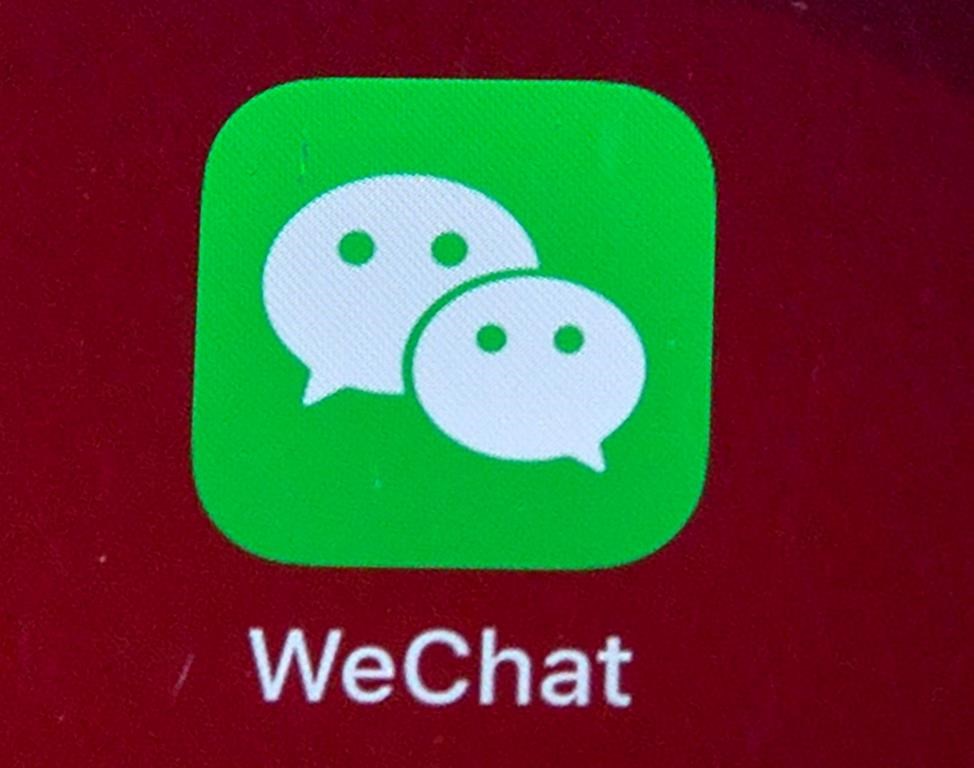 Icon for the smartphone apps WeChat is shown on a smartphone screen in Beijing, on Aug. 7, 2020. The federal government is banning WeChat and Kaspersky applications from its phones over security concerns. THE CANADIAN PRESS/AP/Mark Schiefelbein