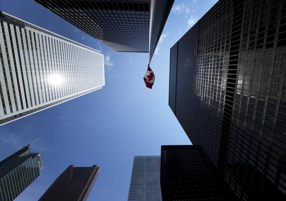 Statistics Canada is set to release its August gross domestic product report this morning. The Bay Street Financial District is shown with the Canadian flag in Toronto on Friday, August 5, 2022. THE CANADIAN PRESS/Nathan Denette