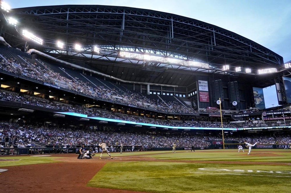 FILE - The Arizona Diamondbacks and the San Diego Padres compete during the sixth inning of a baseball game at Chase Fiekld in Phoenix, Ariz., Saturday, April 22, 2023. The roof will be open for World Series Game 3 at Chase Field, where forecast called for clear skies and a 76-degree temperature for the early evening start Monday, Oct. 30. (AP Photo/Matt York, File)