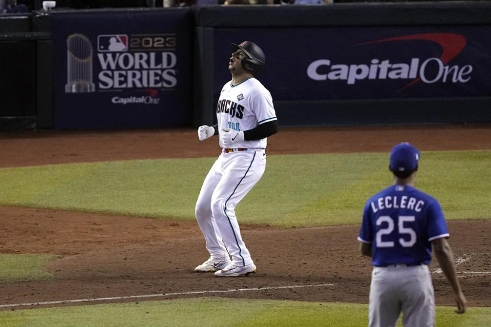 Arizona Diamondbacks' Gabriel Moreno (14) reacts after being called out on strikes during the ninth inning in Game 3 of the baseball World Series against the Texas Rangers Monday, Oct. 30, 2023, in Phoenix. The Rangers won 3-1. (AP Photo/Ross D. Franklin)